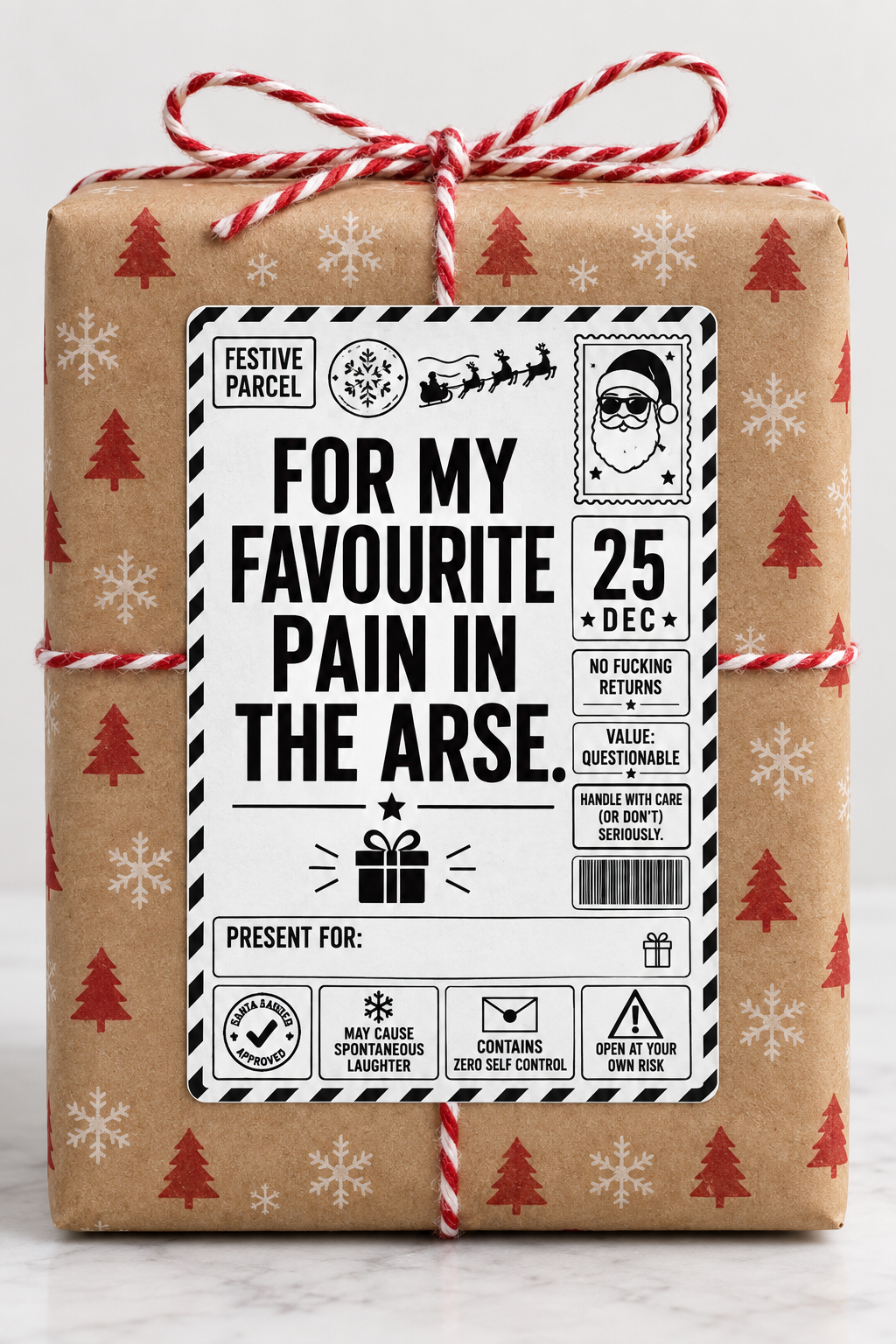 Rude Christmas parcel label design reading "For my favourite pain in the arse"